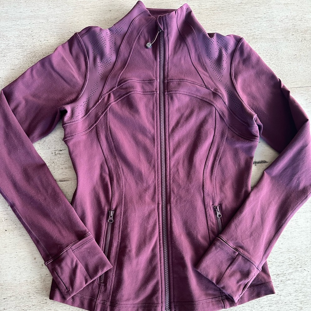 Burgundy wine color, mesh design at shoulders and middle back panel